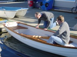 Harold Aune helps Drew launch boat